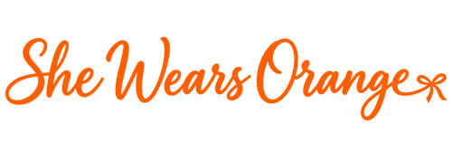 She Wears Orange — horizontal orange script logo with a bow